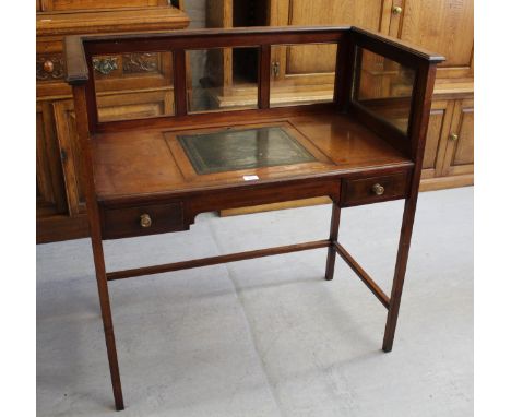 Edwardian mahogany writing table having mirrored and clear glass galleried top with central green leather fitted adjustable w