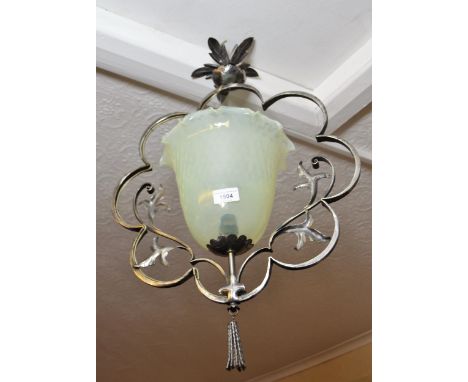 Polished metal floral design light fitting with a vaseline glass shade, 21ins approximate overall drop 