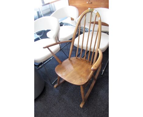 Mid 20th Century Ercol stickback rocking chair (at fault), together with a mid 20th Century teak ladderback chair and a Georg