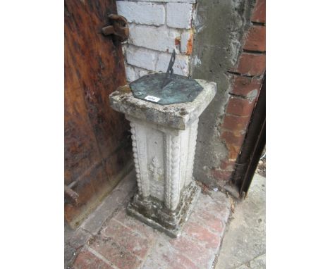 Green patinated metal octagonal sundial bearing date 1742, on a cast concrete plinth, 26ins high overall 