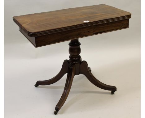 Regency mahogany fold-over card table on a turned column support with quadruped, 36ins wide 