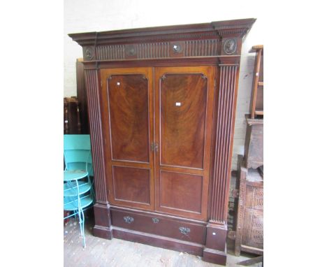 Large 19th Century mahogany two drawer wardrobe, the moulded dentil cornice above a moulded frieze decorated with patera and 