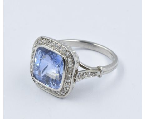 Cornflower blue natural Ceylon sapphire ring, the cushion shaped centre stone of approximately 8.47ct, surrounded by brillian