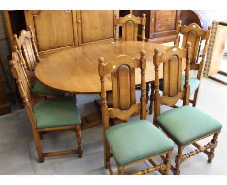 Good quality reproduction oak dining room suite comprising:  set of six high back dining chairs with upholstered seats on tur