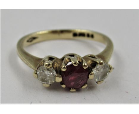 9ct Yellow gold three stone ruby and diamond ring, size J 