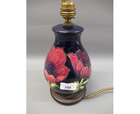 Moorcroft table lamp decorated with the Anemone pattern on blue ground, 8.75ins high including the original wooden base 