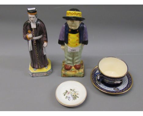 Two Quimper pottery figures St Yevs & Berthe Savigny, 9.25ins high, together with a Quimper cup and saucer and two small Roya