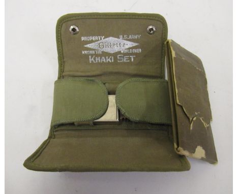 Khaki canvas cased travelling shaving set by Gillette for the U.S Army and an early 20th Century army sewing kit. 