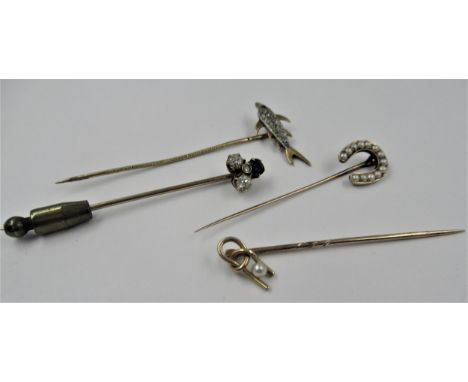 Diamond and sapphire mounted stickpin, another diamond and ruby set stickpin, in the form of a fish, and two other pearl set 