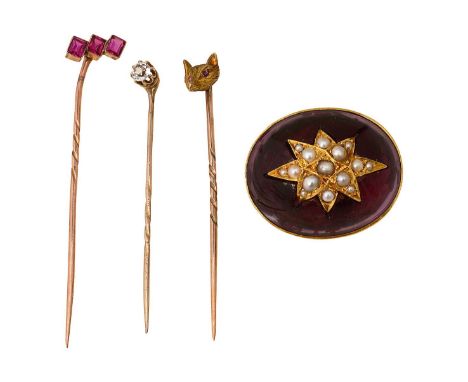 Three stick pins three stone ruby stick pin, set with three rectangular cut rubies; a fox head stick pin, with pink-gem caboc