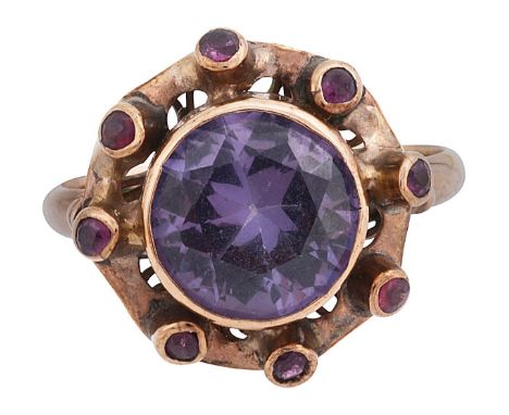 An 'alexandrine' ringthe synthetic corundum collet set above the shaped plaque with raised ruby-set collets, the shank stampe
