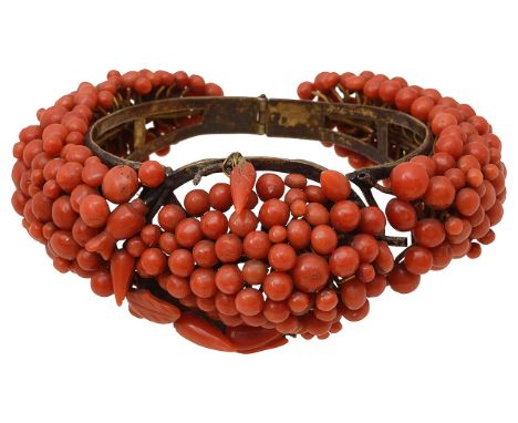 19th Century beaded  coral hinged banglefeaturing circular and ovoid coral, with push clasp, unmarked total approx. weight 61