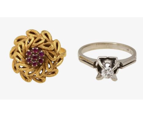 A floral ruby cluster ringseven circular-cut rubies, set above an open-work floral mount, to a plain tapering shank, stamped 