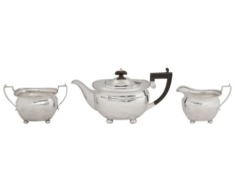 A George VI silver three piece tea serviceBirmingham, 1938, Elkington &amp; Coof oblong bellied form with gadrooned rims on c