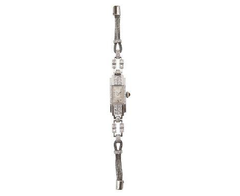 A 1930s platinum, white gold and diamond lady's cocktail bracelet wristwatch  the rectangular dial with Arabic numerals, blue