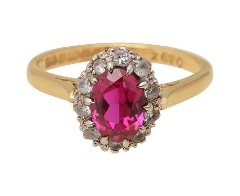 A synthetic ruby and white stone ringthe oval synthetic ruby claw-set above the surround of white stones to the plain 18ct ye