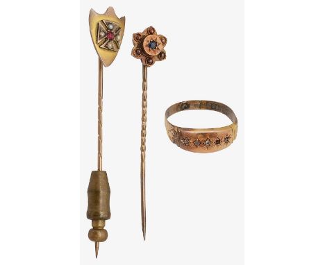 A group of accessories15ct gold gypsy ring, stamped with hallmarks; a floral stick pin, set with a blue gem, stamped to pin h