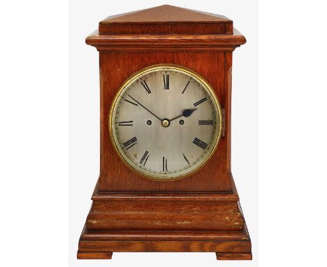 A late Victorian oak cased bracket clock circular steel dial with Roman numerals, minute track and blued steel hands, brass f