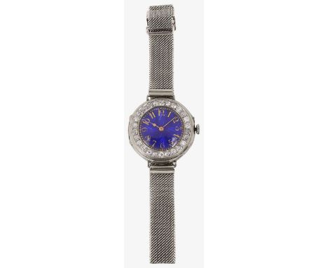 An 18ct manual wind white gold and enamel lady's wristwatch the engine turned blue enamel dial with gilt Arabic numerals and 