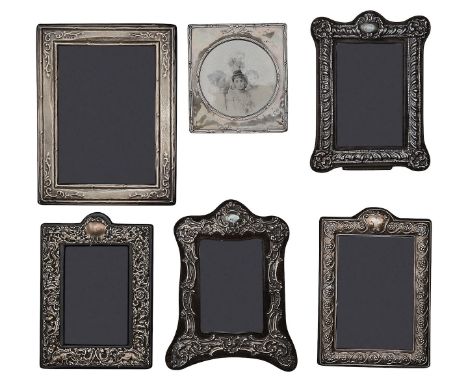 Two Edwardian silver mounted photograph frames and four modern frames first Birmingham, 1908, William Devenport, square with 