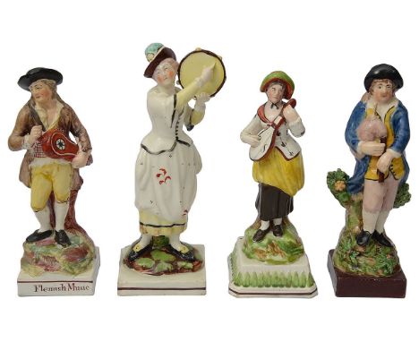 Four early 19th century Staffordshire pearlware figures of musicianscomprising a a bagpipe player with bocage c.1820 with bla