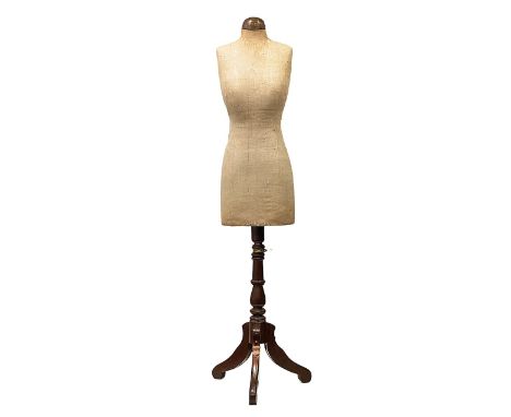 An early 20th century shop display mannequin or dress makers dummylinen torso, on adjustable wooden tripod base, stencilled 3