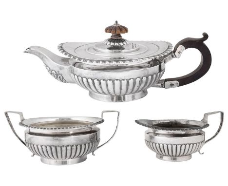 A late Victorian silver three piece bachelors tea serviceLondon, 1891, Charles Stuart Harrisof ovoid tapering half fluted for