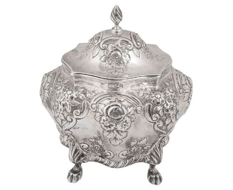 A late Victorian silver tea caddyChester, 1896, George Nathan &amp; Ridley Hayesof bombe lobed form embossed with flowers and