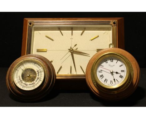 A Metamec rectangular wall clock, baton indicators, sunbursts to angles, 36cm x 26cm; a porthole type brass wall clock; an oa