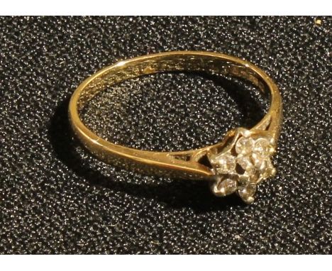 A 9ct gold diamond cluster flower head ring, 1.7g, boxed 