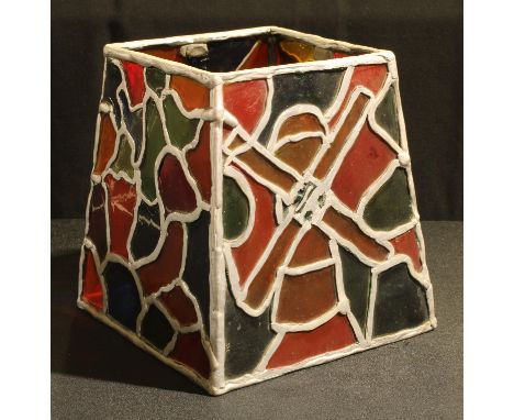 A leaded glass style four panel lamp shade, panels with stylised windmill, flowers, etc 