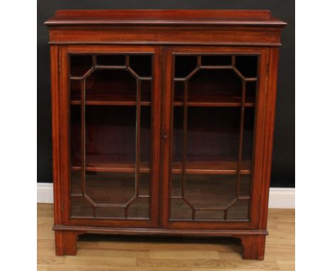 An Edwardian mahogany astragal glazed low library bookcase, outlined with boxwood stringing, bracket feet, 115cm high, 103cm 