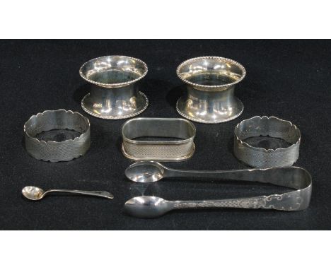 A pair of silver napkin rings, Birmingham 1902; a pair of silver napkin rings, Birmingham 1939; a pair of late Victorian silv