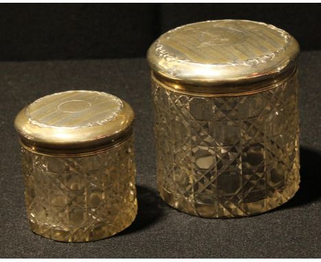 A silver mounted cut glass dressing table jar, hobnail cut, the engine turned silver cover with vacant cartouche, ribbon tied