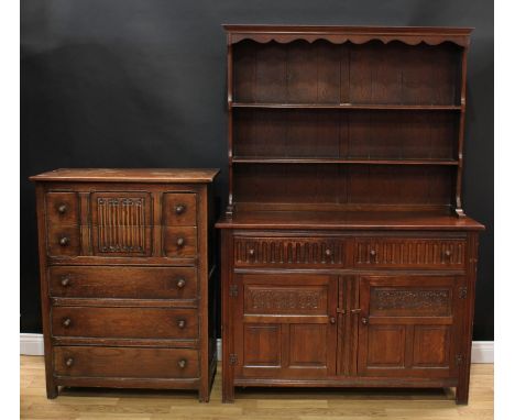 A 17th century oak dresser, shaped apron above a pair of plate racks, the projecting base with two short drawers above two pa