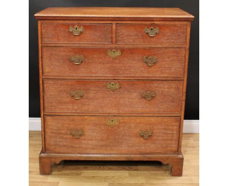 A 19th century oak chest, slightly oversailing rectangular top above two short and three long graduated cockbeaded drawers, s