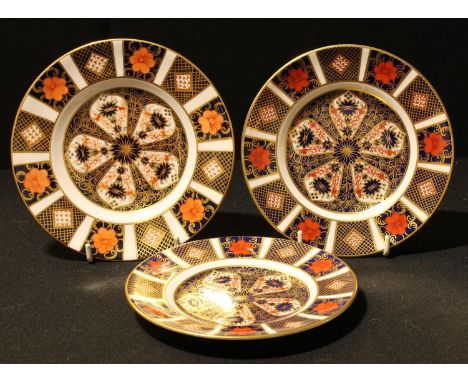 A pair of Royal Crown Derby Imari 1128 pattern tea plates, 16cm, first quality; another, 16.5cm, second quality (3) 