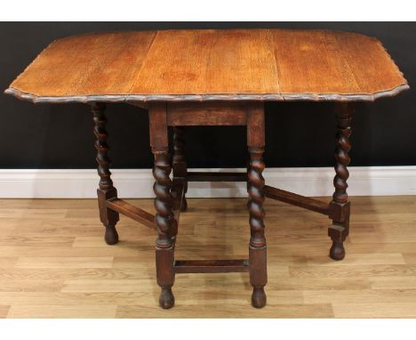 An oak drop leaf gate-leg table, shaped moulded edge, barley twist supports, 71cm high, opening to 120cm long, 91cm wide, ear