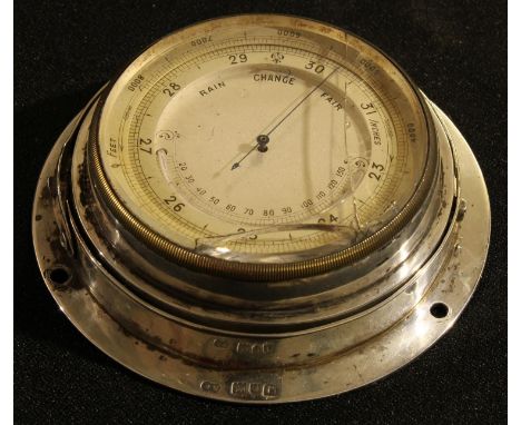 A George V silver aneroid barometer, 9.5cm diam, London 1913 