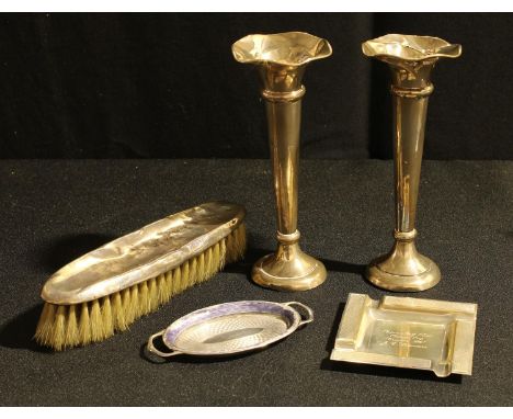 A pair of silver trumpet shaped posy vases, hollow filled, 15cm, Birmingham 1920; a silver miniature two handled tray, engine