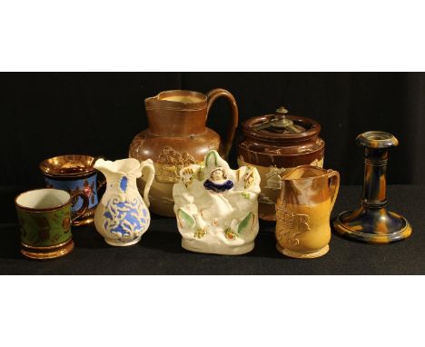 A Royal Doulton two tone salt glazed tobacco jar and cover, applied with tavern and hunting scenes; a Doulton Lambeth 'leathe