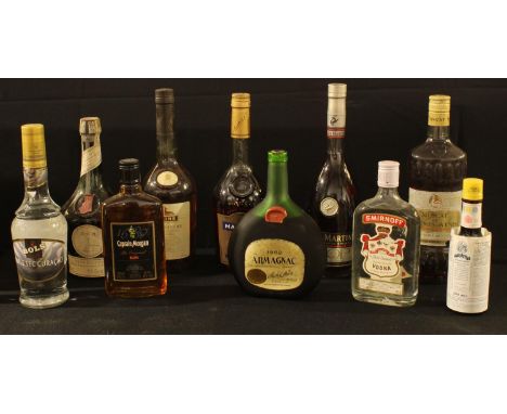 A bottle of Smirnoff Vodka 35cl; a bottle of Captain Morgan Rum, 35cl; a bottle of Hine Signature Cognac, 70cl; a bottle of M