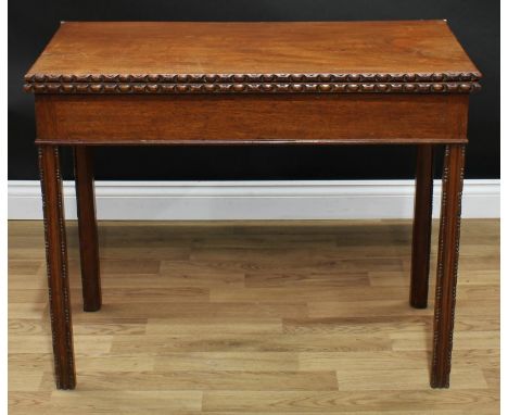 A George III mahogany card table, rectangular top with egg-and-dart edge enclosing a baize lined playing surface, moulded cha