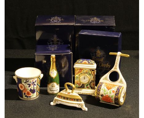 A Royal Crown Derby miniature model of an iron, Traditional Imari pattern, first quality, boxed; a Lotus Blossom pattern mini