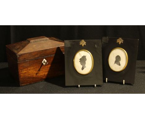 A 19th century mahogany sarcophagus tea caddy, 19cm wide; a pair of Victorian silhouette portraits (3) 