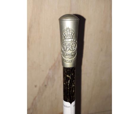 An ebonised George VI swagger stick with descriptive metal top.  