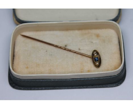 A sapphire and split pearl stick pin, marked '9ct', gross wt. 1.02g.  