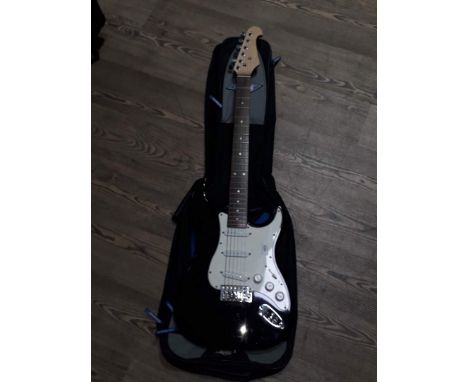 A Redwood black Strat copy electric guitar with soft case and Korg tuner GA-30.  