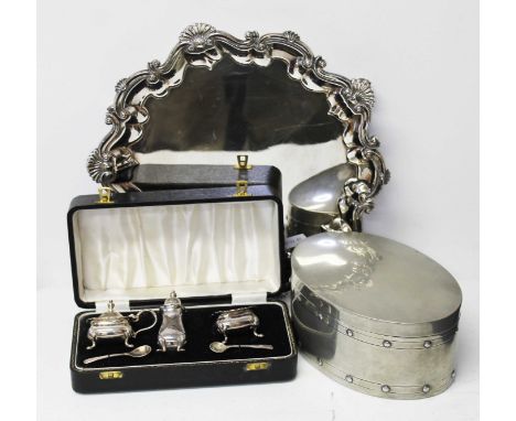 A mixed lot of metal ware comprising a Craftsman pewter tea caddy of oval form, a silver plated tray and a cased silver plate