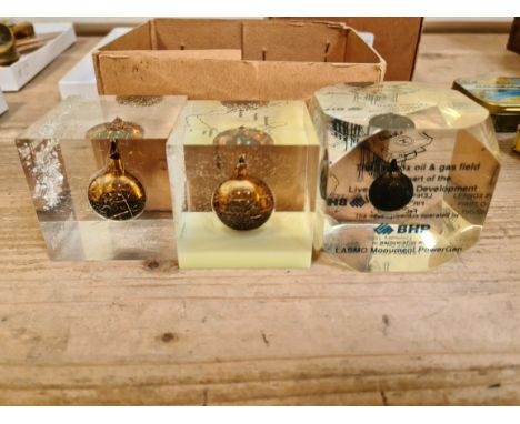 3 perspex paperweights, each containing a 2cc drop of oil, map &amp; descriptions - one having Damman No. 7 light crude oil S